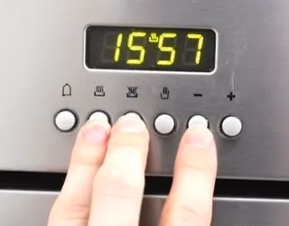 Setting the clock on a new oven is a critical step